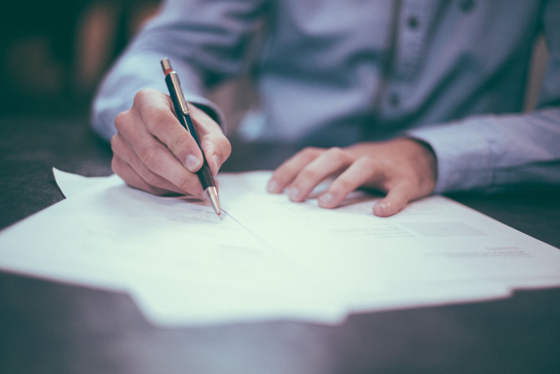 a person filling out a form